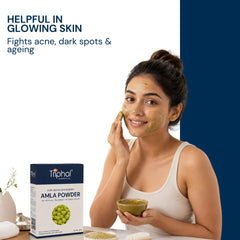 Triphal Amla powder face mask being applied for glowing, clear skin