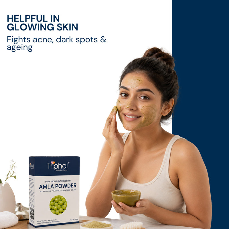 Triphal Amla powder face mask being applied for glowing, clear skin